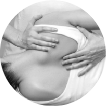 Hands performing a chiropractic adjustment on a woman's back